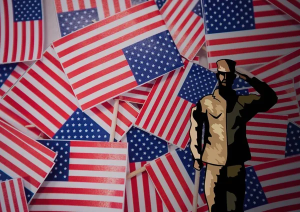 Veterans day soldier in front of flag — Stock Photo, Image