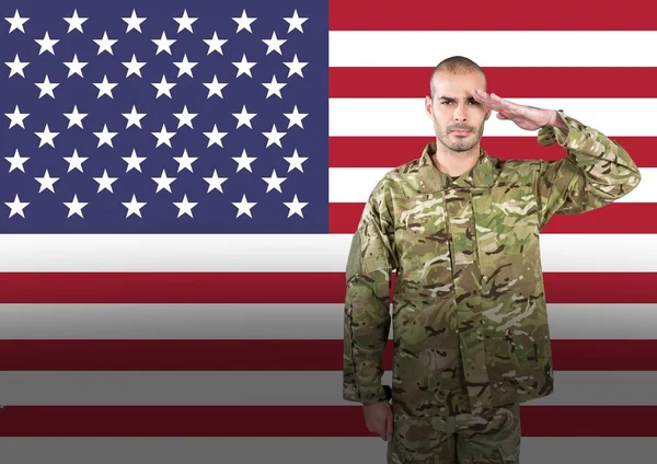 Veterans day soldier in front of flag — Stock Photo, Image