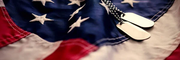 Dog tag chains on flag