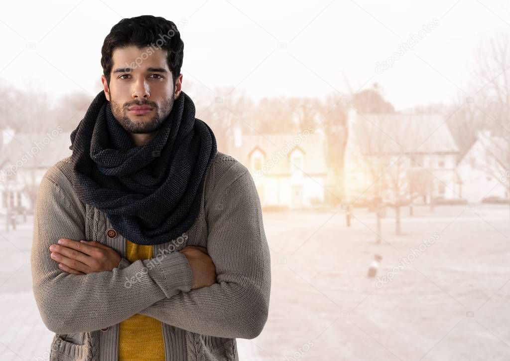Man in Autumn with with scarf and folded arms 