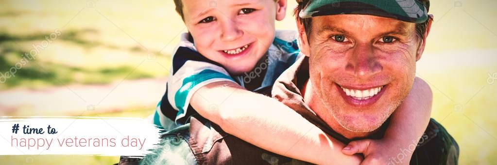 Logo for veterans day in america hashtag against happy soldier giving piggyback to his son
