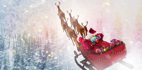 Kerstman op de slee rijden — Stockfoto