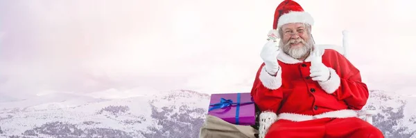 Santa holding glass of milk — Stock Photo, Image