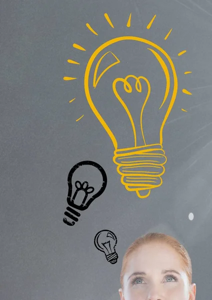 Woman looking up at light bulb — Stock Photo, Image