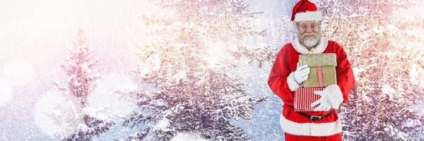 Santa holding gifts — Stock Photo, Image