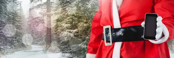 Santa pomocí tabletu — Stock fotografie