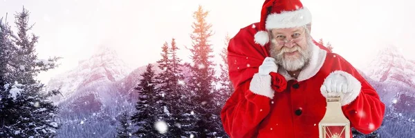 Santa holding lantern — Stock Photo, Image