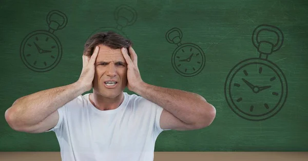 Frustrated man with clocks — Stock Photo, Image