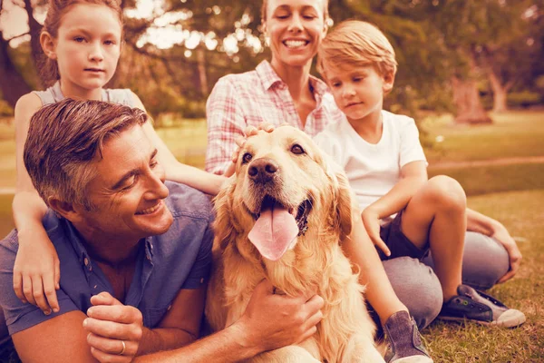 Happy family enjoying with dog — Stock Photo, Image