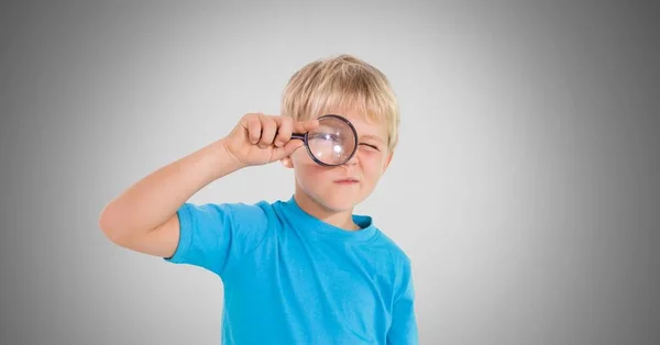 Boy  with magnifying glass — Stock Photo, Image