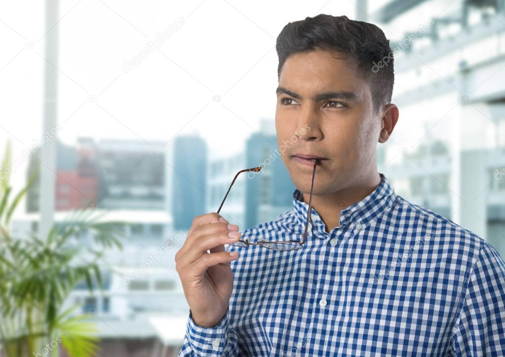 Businessman thinking and concentrating in office