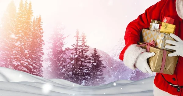 Santa holding gifts — Stock Photo, Image