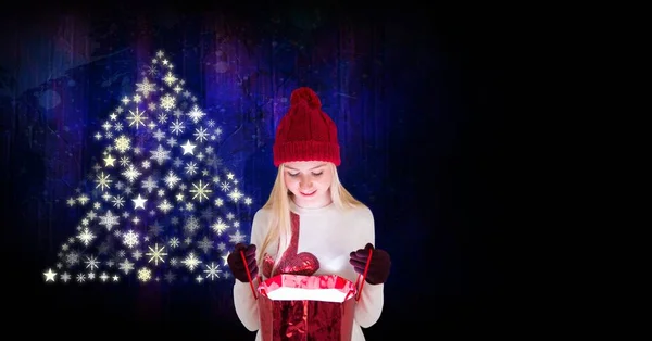 Woman opening gift and Snowflake Christmas tree pattern shape — Stock Photo, Image