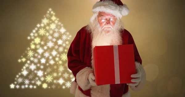 Santa drží krabičky — Stock fotografie