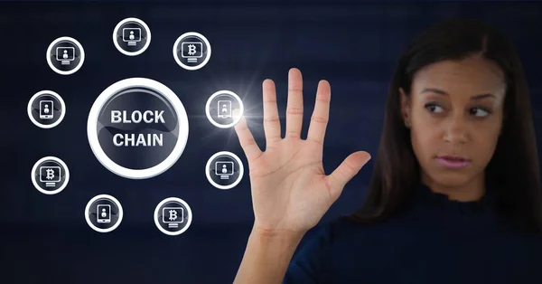 Businesswoman opening hand in front of block chain