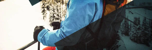 Skier looking at snow-covered mountains — Stock Photo, Image