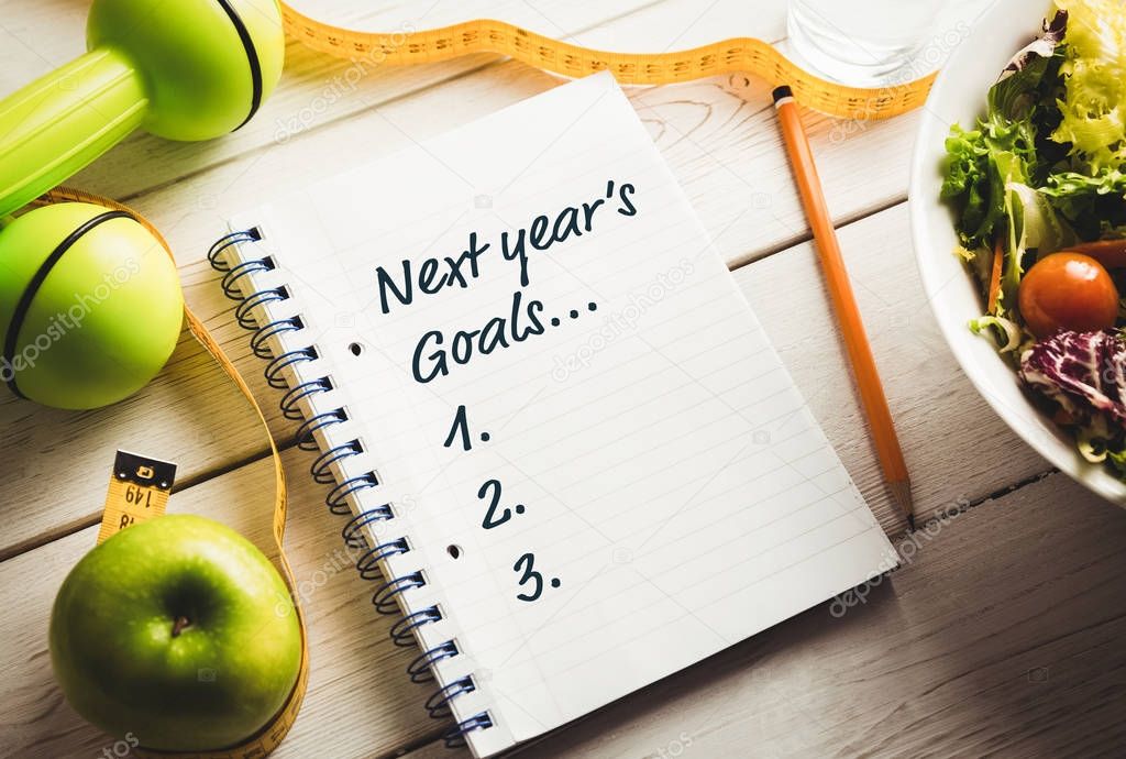 New year's resolutions list on table, healthy lifestyle concept 