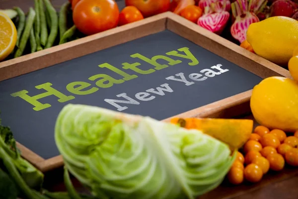 Healthy New Year against wooden tray — Stock Photo, Image