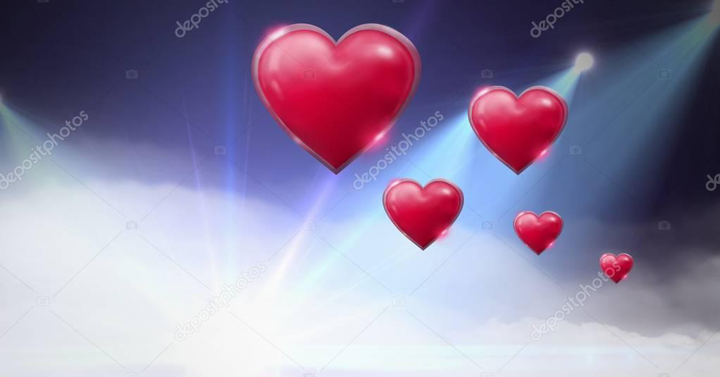 Digital composite of Shiny bubbly Valentines hearts with purple misty lights flares background