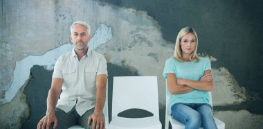 Unhappy couple not speaking to each other  against rusty weathered wall clipart