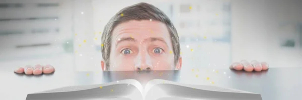 Compuesto Digital Hombre Mirando Libro Abierto Con Luces Una Mesa —  Fotos de Stock