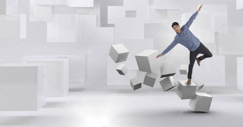 Digital composite of Man balancing on geometric surreal cubes