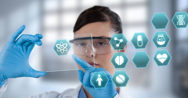 Digital composite of Female doctor holding tablet with medical interface hexagon icons
