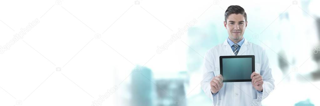 Digital composite of Male doctor holding tablet