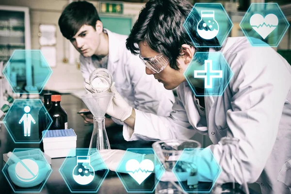 Símbolos Médicos Contra Estudiantes Química Masculina Haciendo Experimento —  Fotos de Stock