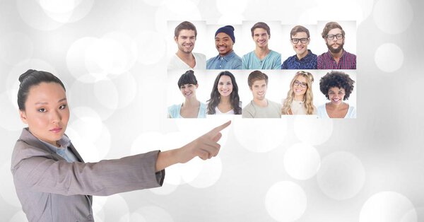 Digital composite of Woman touching portrait profiles of different people