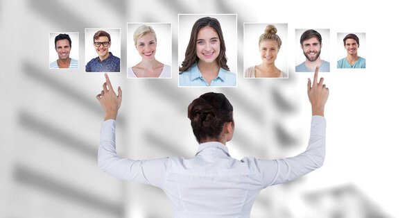 Digital composite of Woman touching portrait profiles of different people