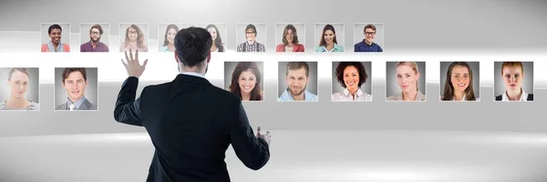 Digital Composite Man Touching Portrait Profiles Different People — Stock Photo, Image