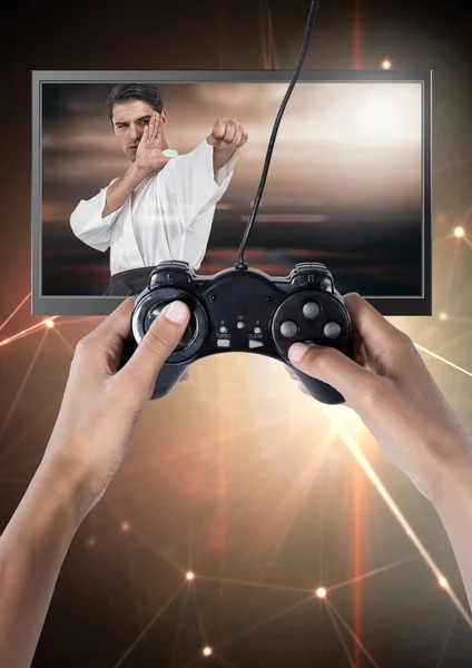 Composto Digital Mãos Segurando Controlador Jogos Com Lutador Artes Marciais — Fotografia de Stock