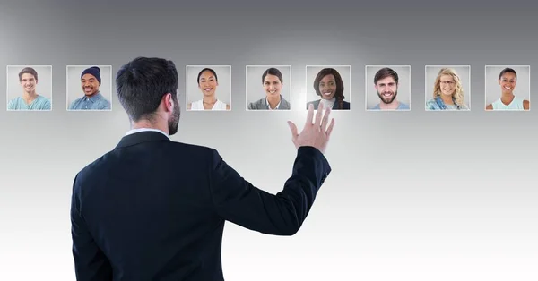 Digital Composite Man Touching Portrait Profiles Different People — Stock Photo, Image