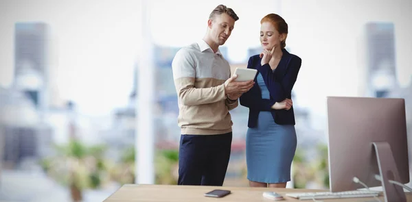 Colleagues Discussing Tablet While Standing Table Look Out Window — Stock Photo, Image