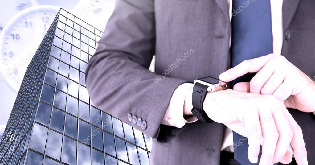Digital composite of Businessman checking time watch and tall building with clocks
