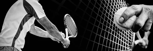 Tennis man against black background