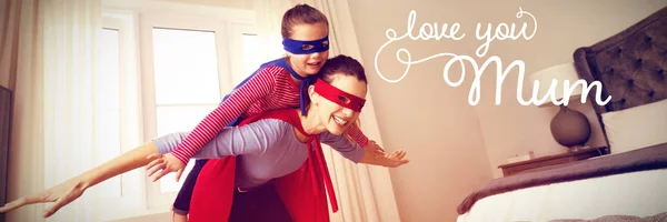 Mother and daughter playing super heroes