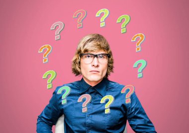 Digital composite of Man thinking with colorful funky question marks clipart