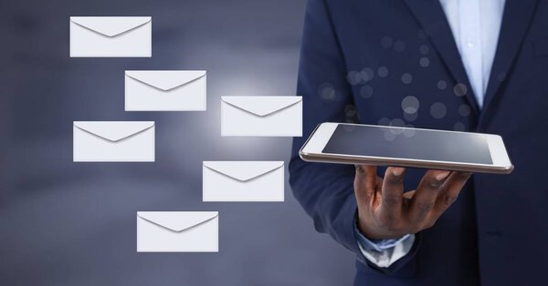 Digital composite of Envelope letter messages and man using tablet