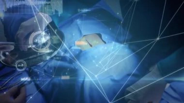 Ameliyathanede cerrahların üzerinde ağır çekimde hareket eden bağlantı ağının animasyonu