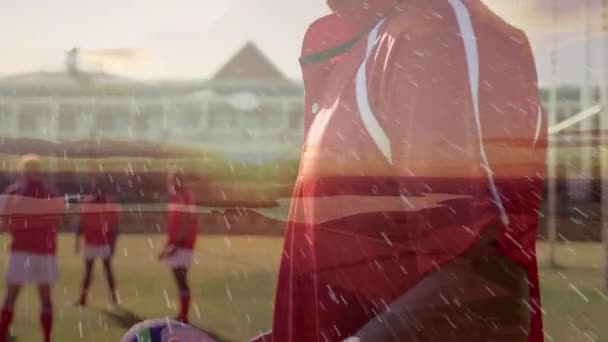 Animation Mixed Race Rugby Player Looking Camera Stadium Rain Foreground — Stock Video