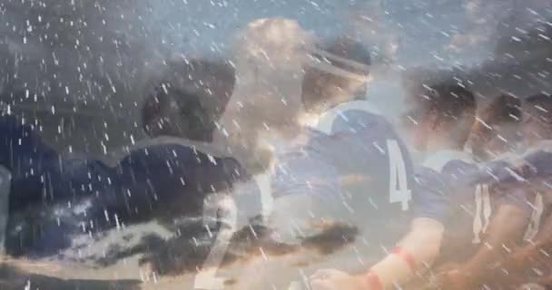 競技場での試合前に国歌を歌うラグビー選手の列のアニメーション 前景に雪が降る4K — ストック動画
