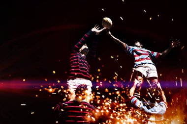 Rugby oyuncuları havai fişeklere karşı parlayan arka plan