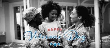 Asker gününe karşı asker çifti ve kızı.