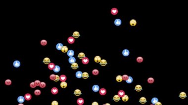 Bir grup emojinin canlandırılması, baş parmaklar yukarı ve siyah arkaplanda uçan kalp simgeleri