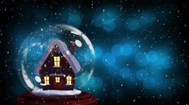 İçinde ev olan Noel kar küresi animasyonu, arka planda kar yağıyor ve mavi ışık lekeleri dağılıyor