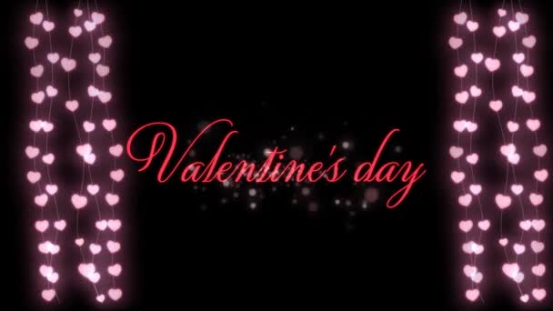 言葉のアニメーションバレンタインデー黒の背景に妖精の光の輝く文字列とピンクで書かれた — ストック動画