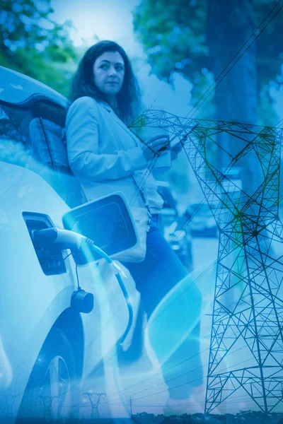 Blue Wave Evening Electricity Pylon Silhouette Businesswoman Charging Electric Car — Stockfoto