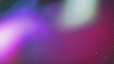 Odaktan çıkmış, çok renkli spot ışıklarının karanlık, parlak arka planda hipnotik hareketlerle hareket etmesinin animasyonu. Dijital hareketin kusursuz döngüsü.